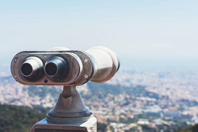 tourist binoculars at a viewing point over Barcelona