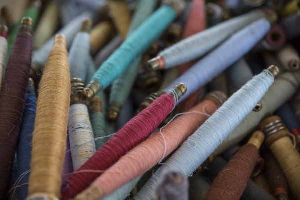 coloured threads on spools