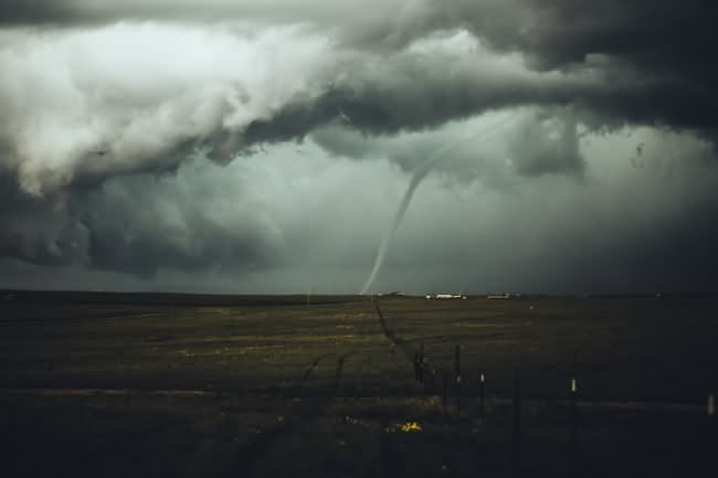 distant tornado over fields