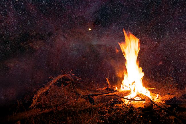 campfire under starlit sky