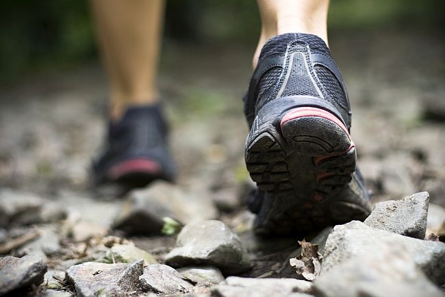 feet of a hill-walker on rocky ground