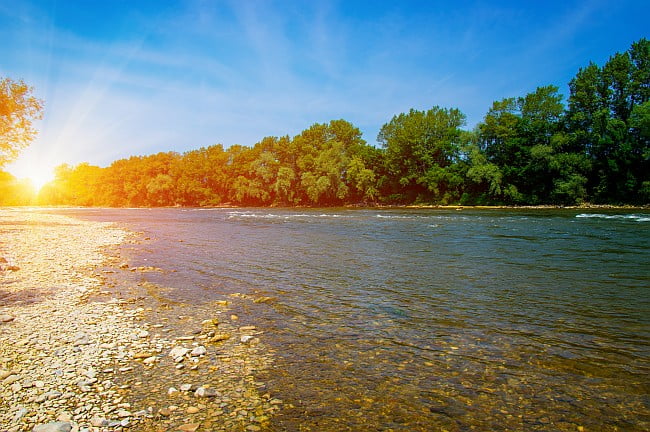 photo: looking across a river at sunset