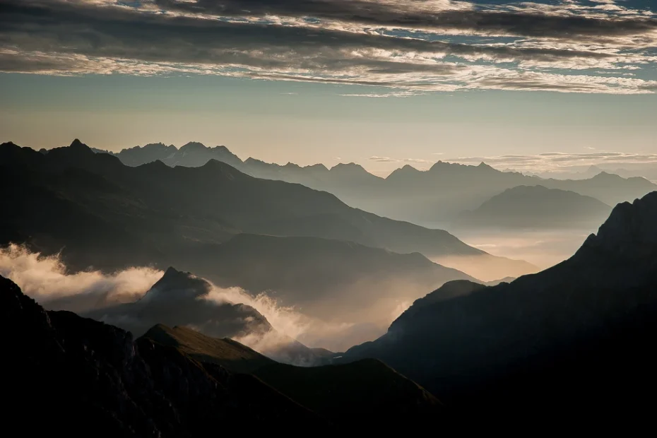 Sunrise over cloudcapped mountains