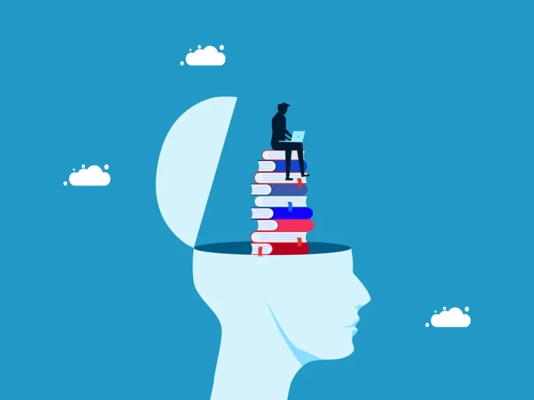 human head filled with books. A small figure sits on top of the stack of books contemplating a laptop screen.